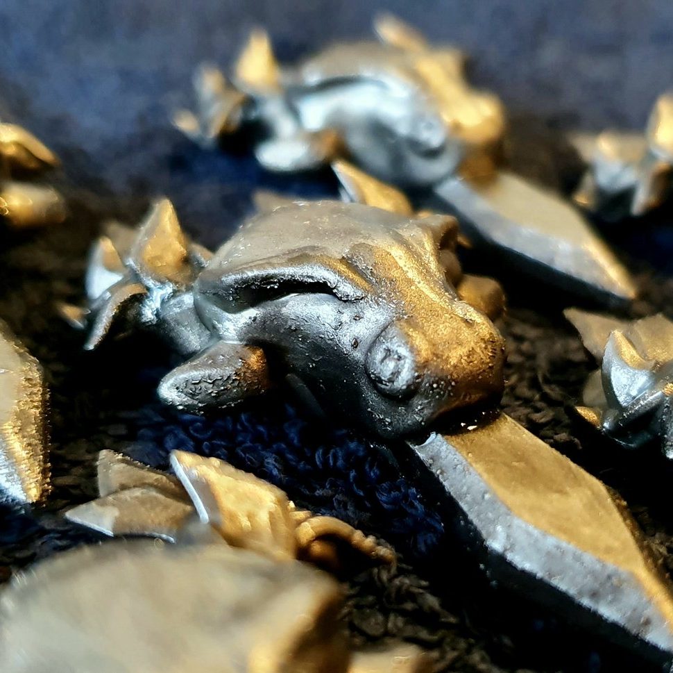 Photograph of 3D printed emblem hangers of a stag.